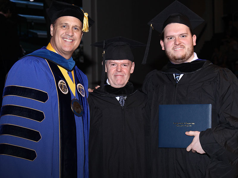Davis father and son graduate with master's degrees