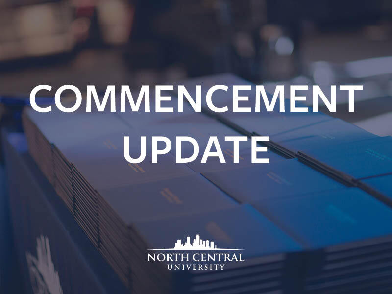 Diploma's in the background with white commencement update text