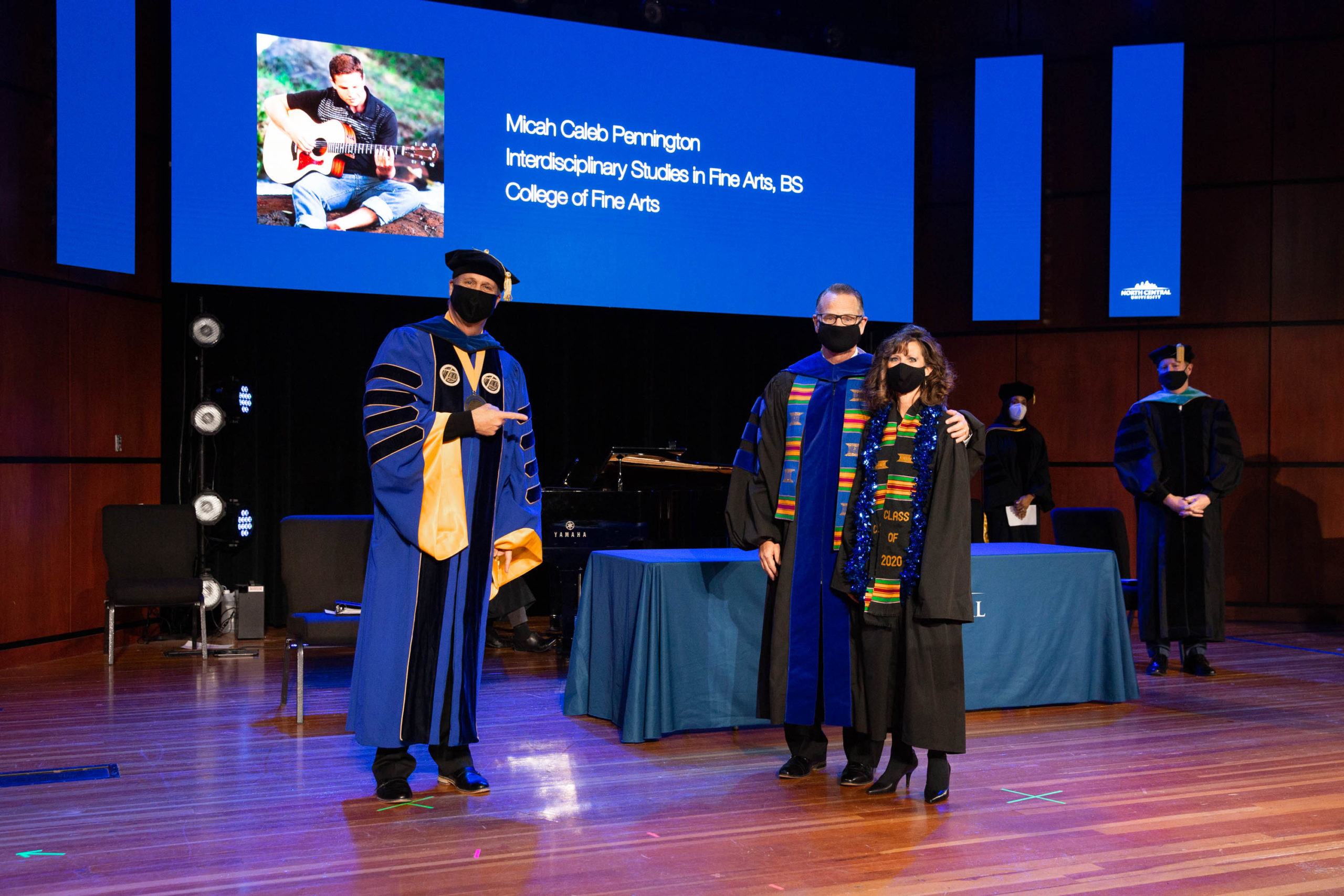 Steve and Trina Pennington with President Scott Hagan, receiving Micah Pennington's diploma