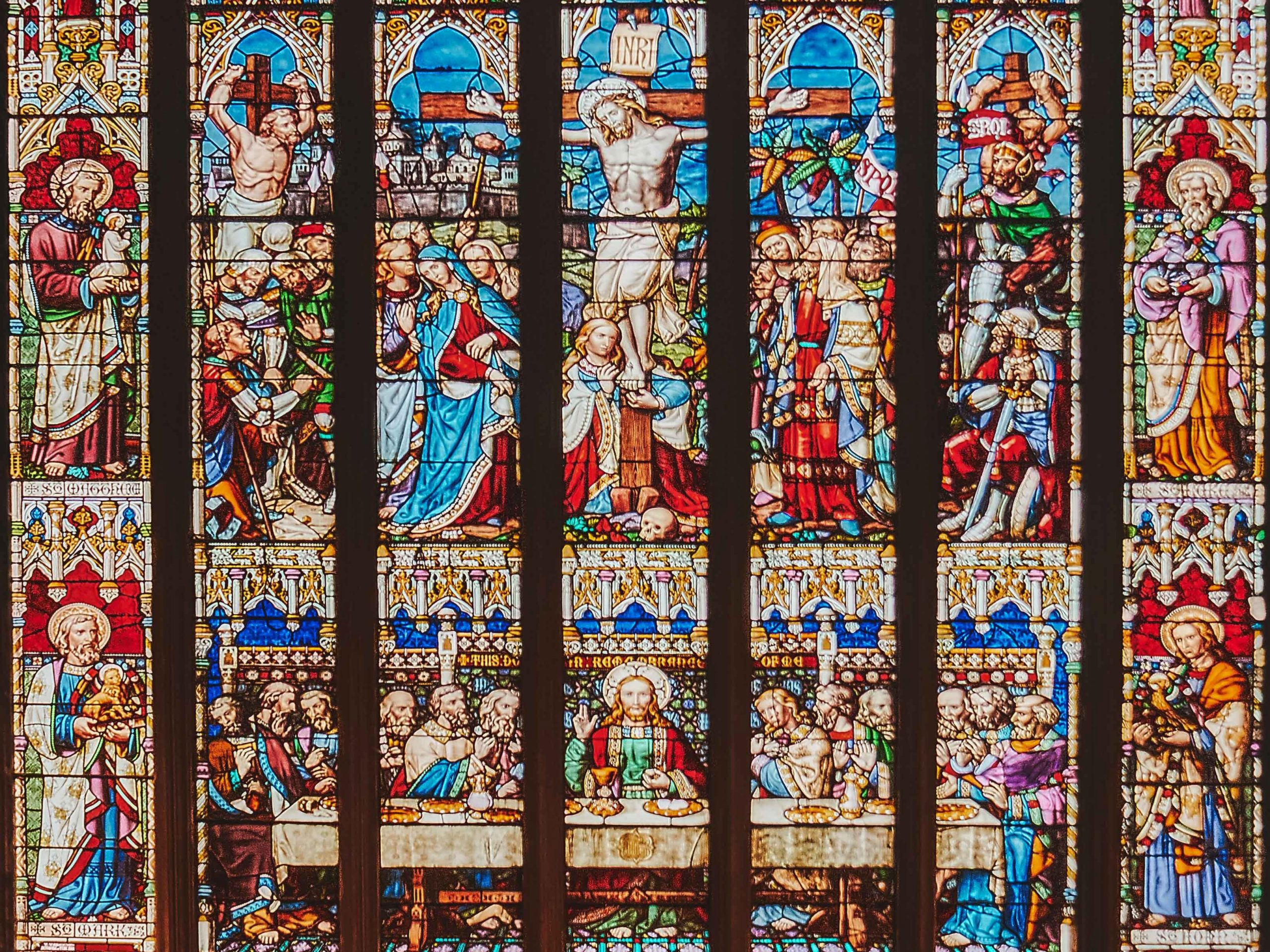 Stained-glass imagery of Christ's crucifixion and last supper