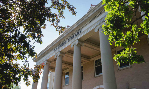 Outside shot of the T.J Jones Library in the summer.