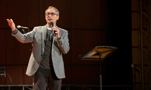 Preacher speaking in a worship hall.