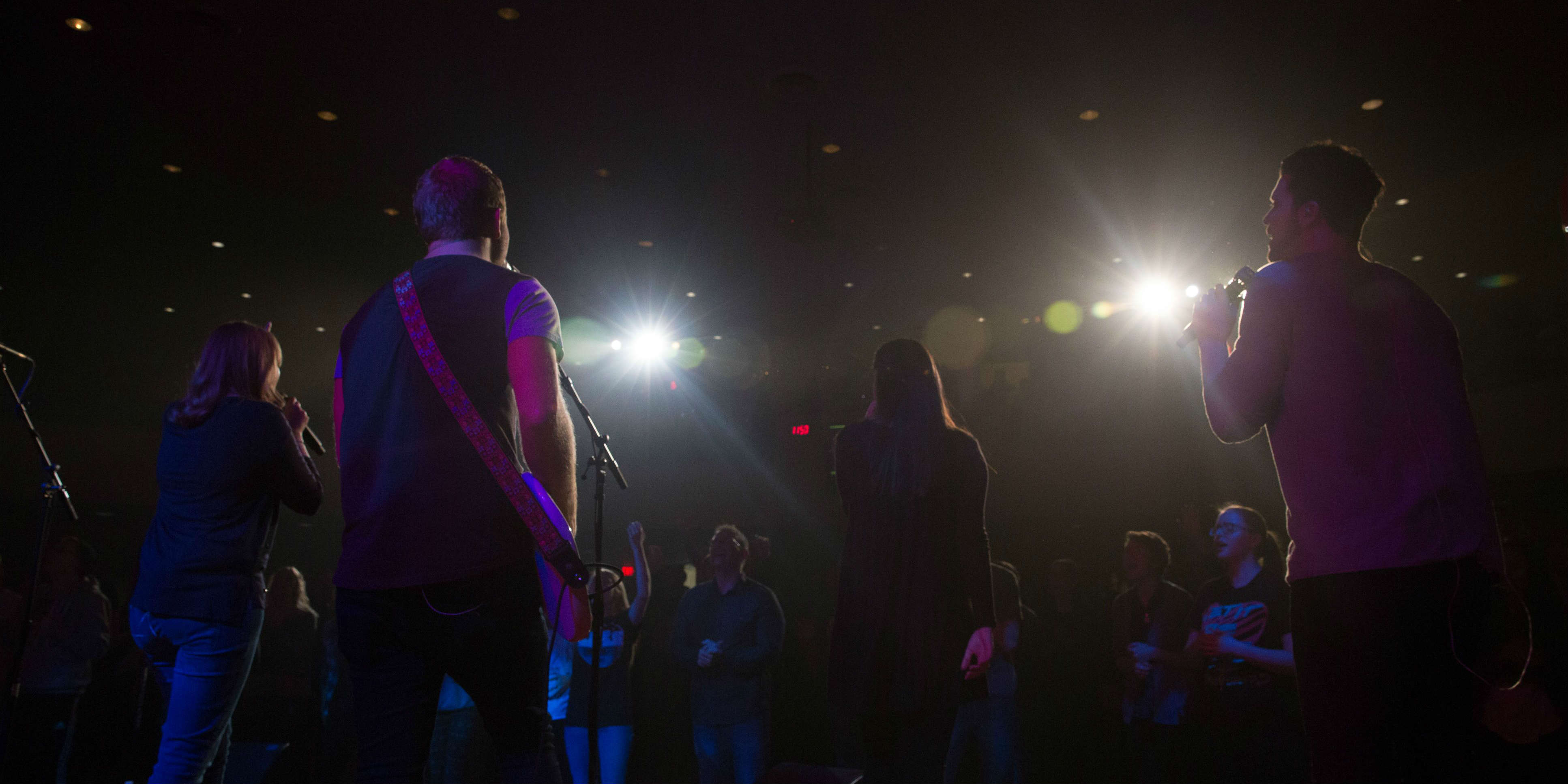 Worship team under the lights.