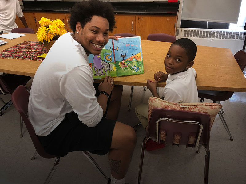 North Central athletes help elementary school students read