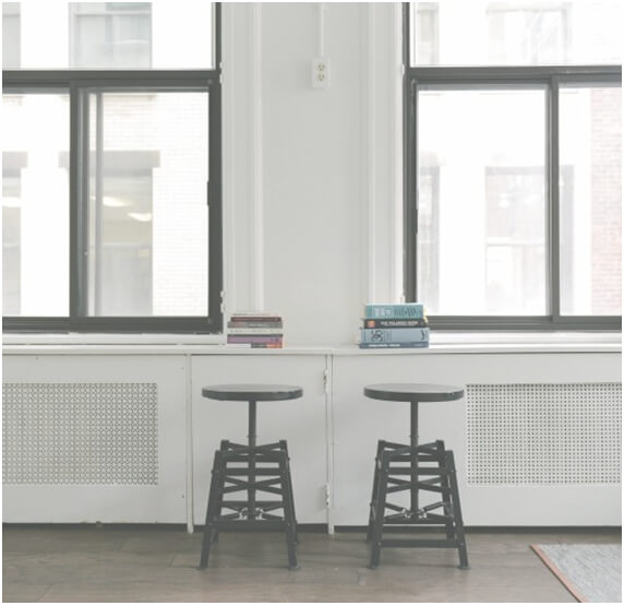 two stools in an empty room