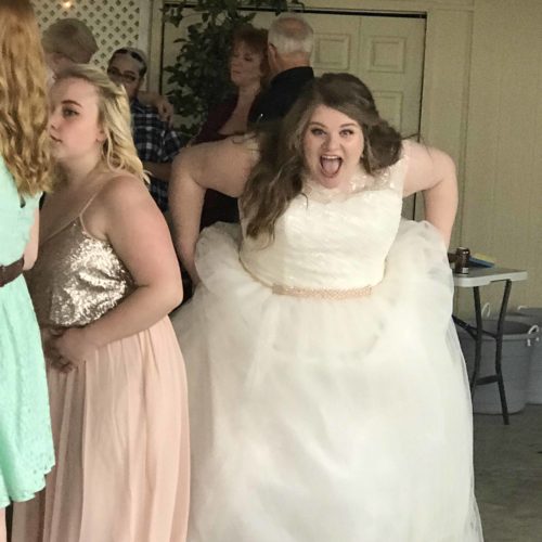 Girl excited in wedding dress