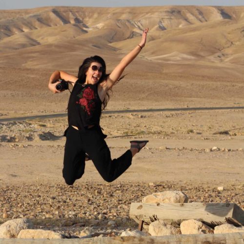Girl jumping in the desert