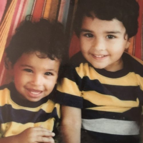 Two boys in matching striped shirts