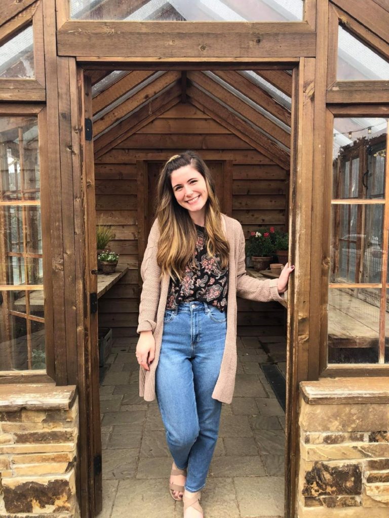 Hanley posing in wooden shed