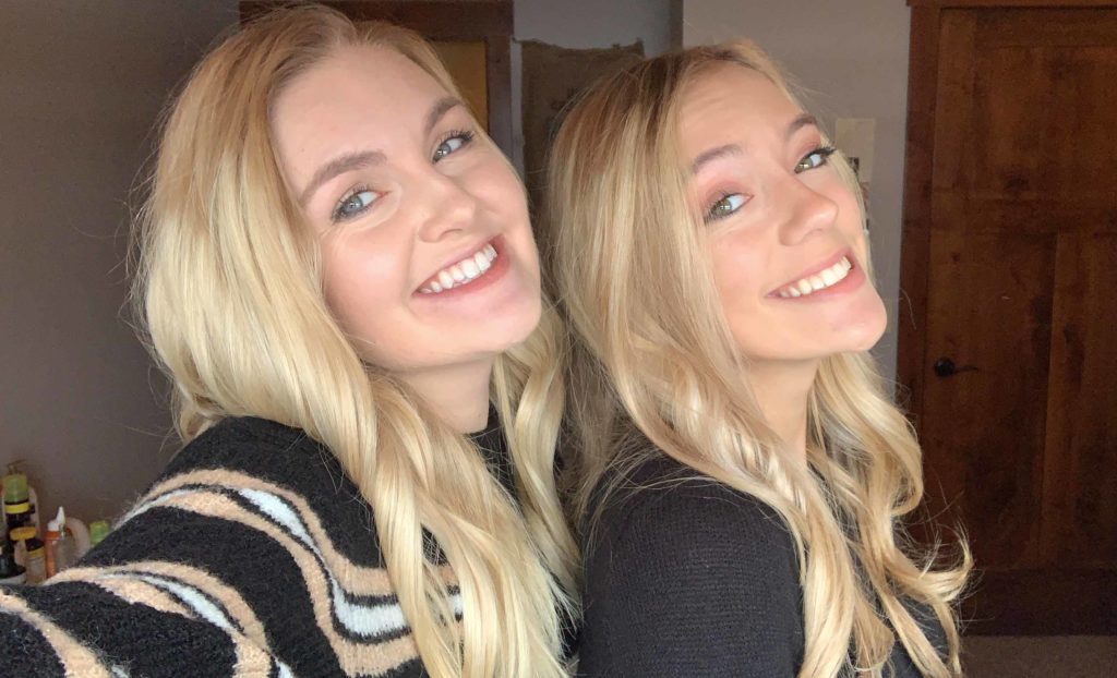Two blonde girls smiling