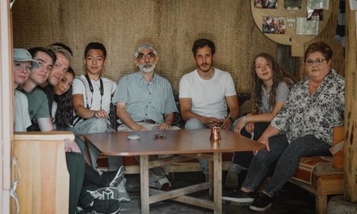 group of people sitting around a table
