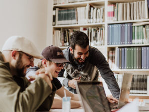 three people working in an office