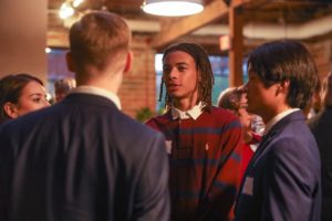 Students in Business attire conversing