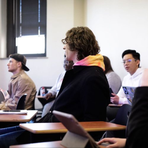 Students sit at their desks, focused and ready to learn