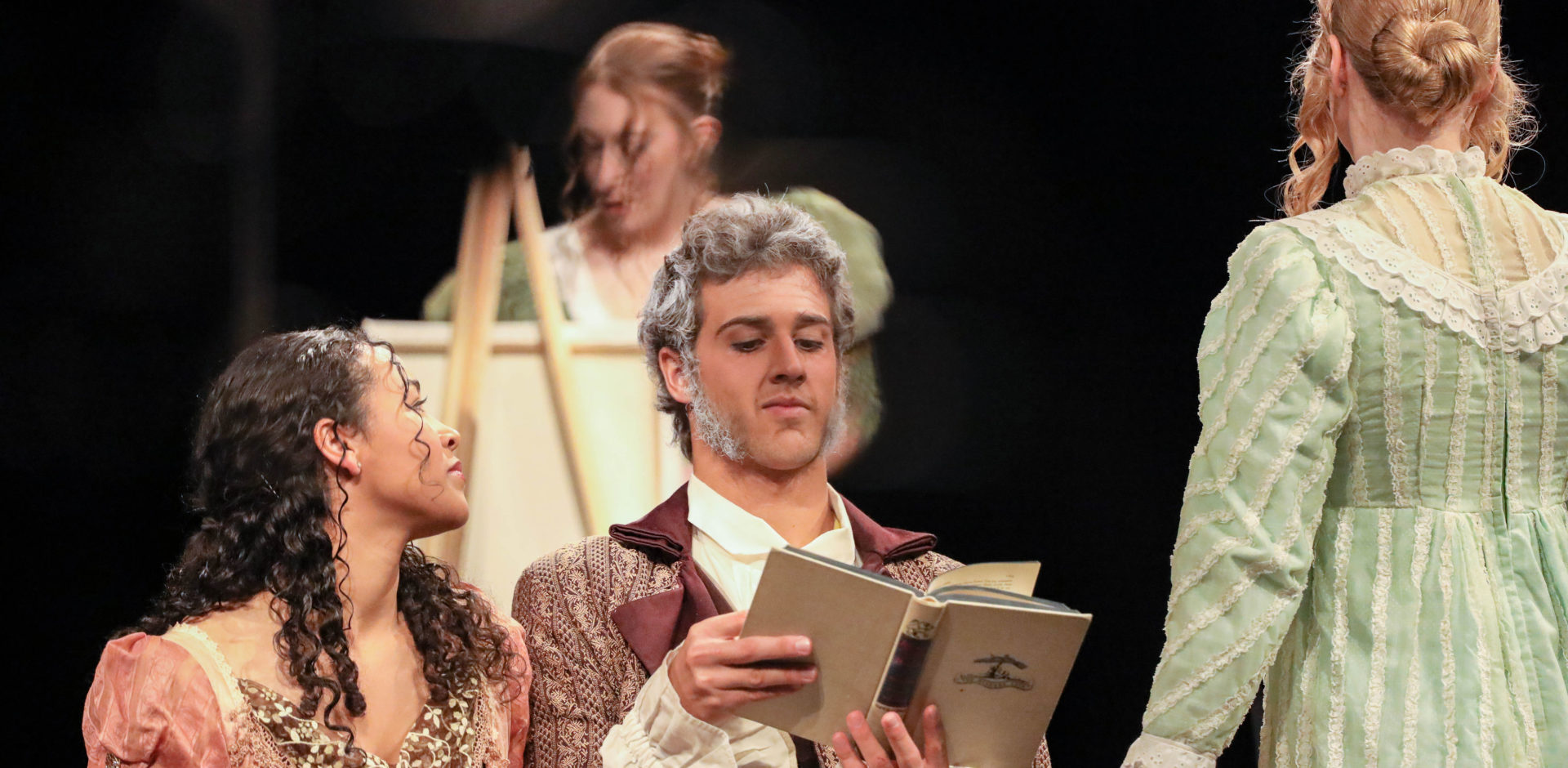 Students dress in period clothing for a stage performance