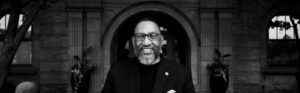 Dr. Darnell Williams in front of Miller Hall