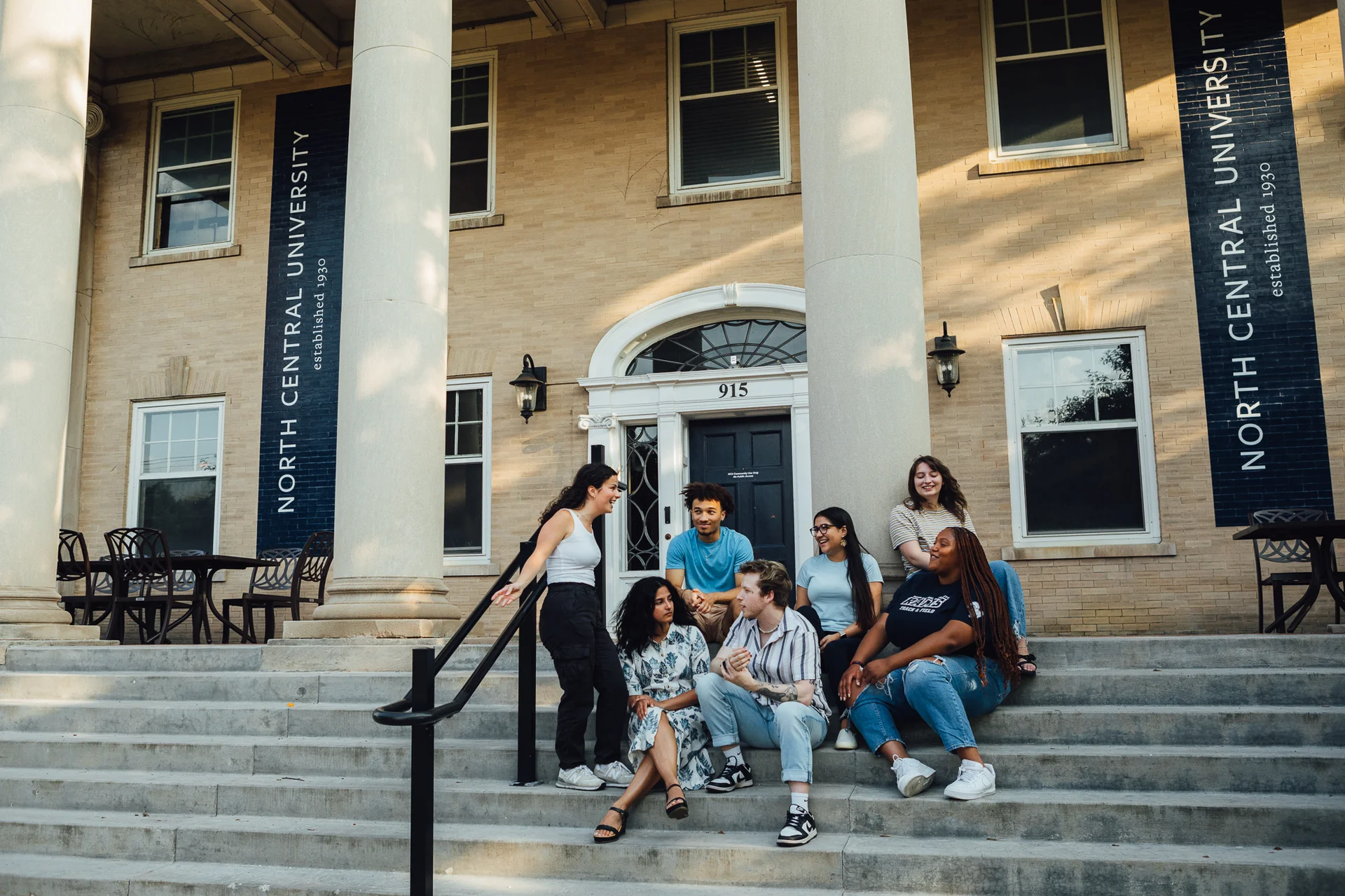 Students on campus at North Central University during a visit or tour.